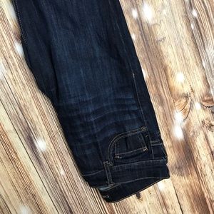 Express skinny jeans with distressed ankles